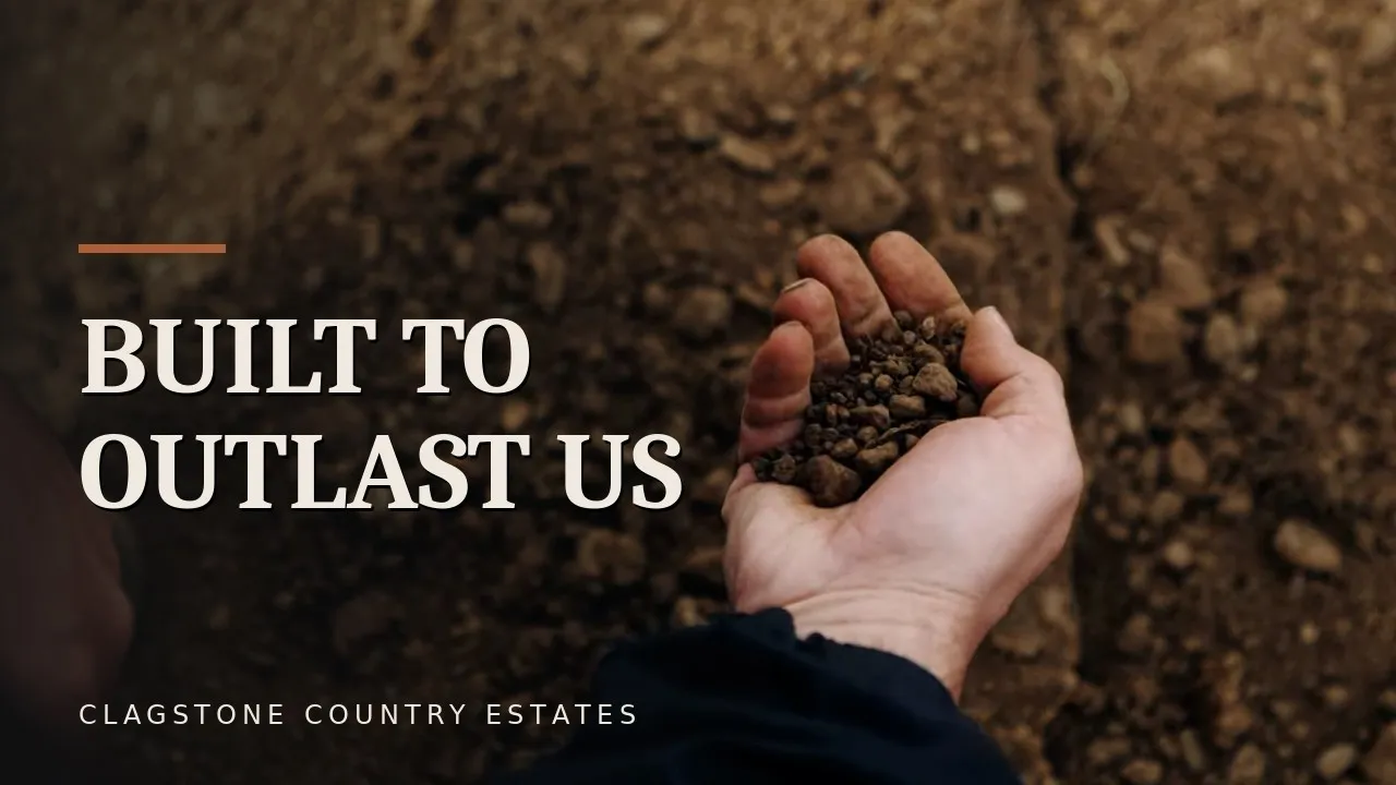 A close-up of two hands cradling rich Rathdrum Prairie soil at Clagstone Country Estates.
